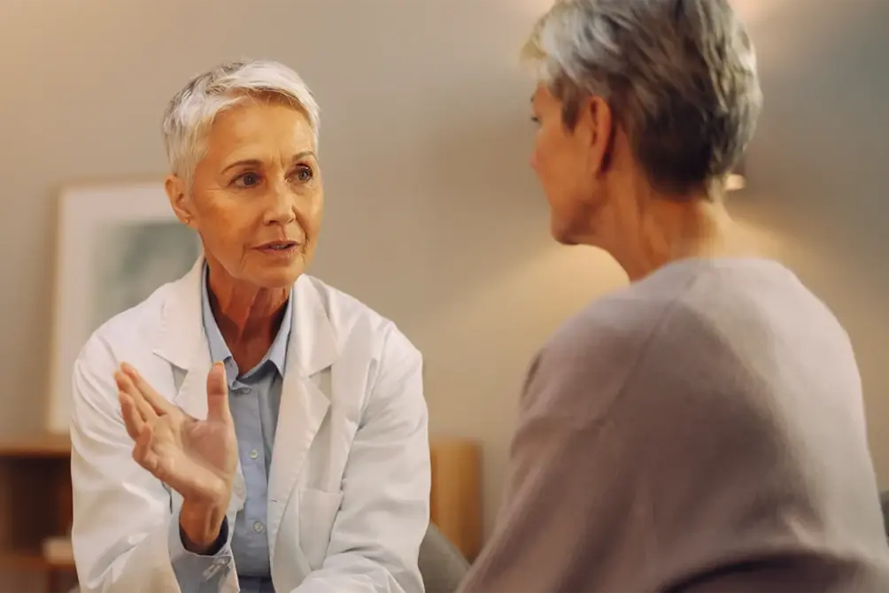Physician talking with an older patient about a CT lung cancer screening