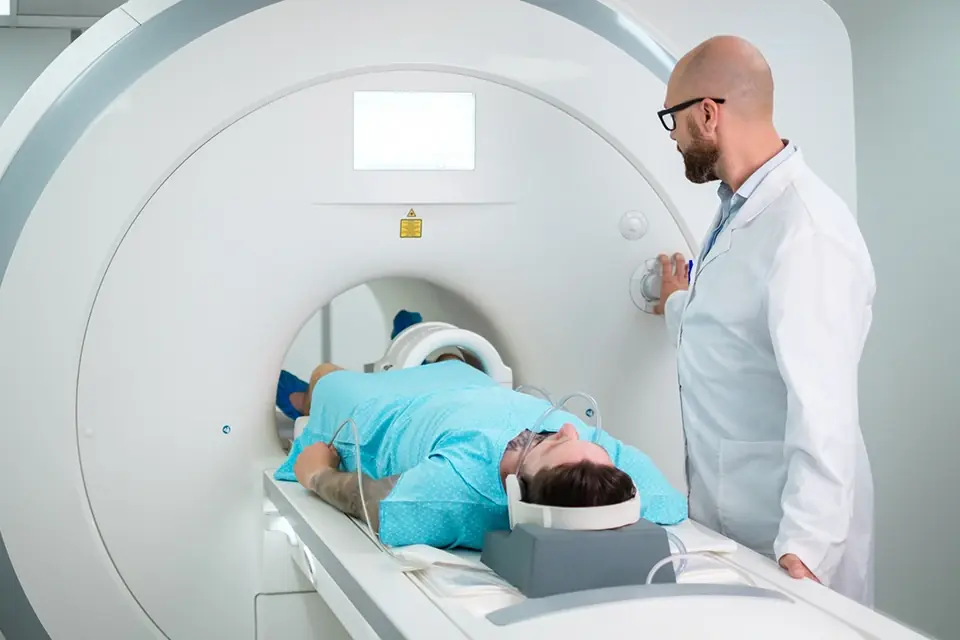 Man lying on a scanner table, ready for his scan